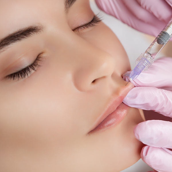 Botox inserted into lips