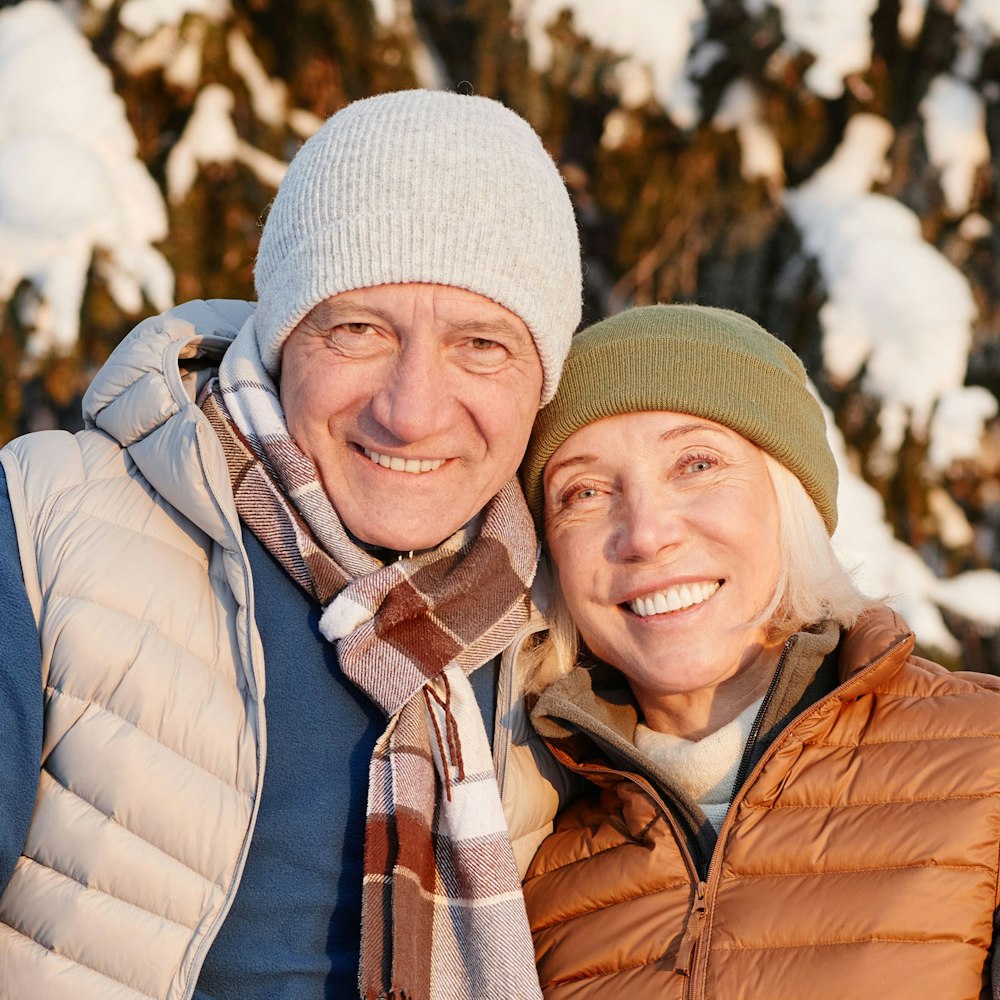 Smiling mature couple in a snowy location