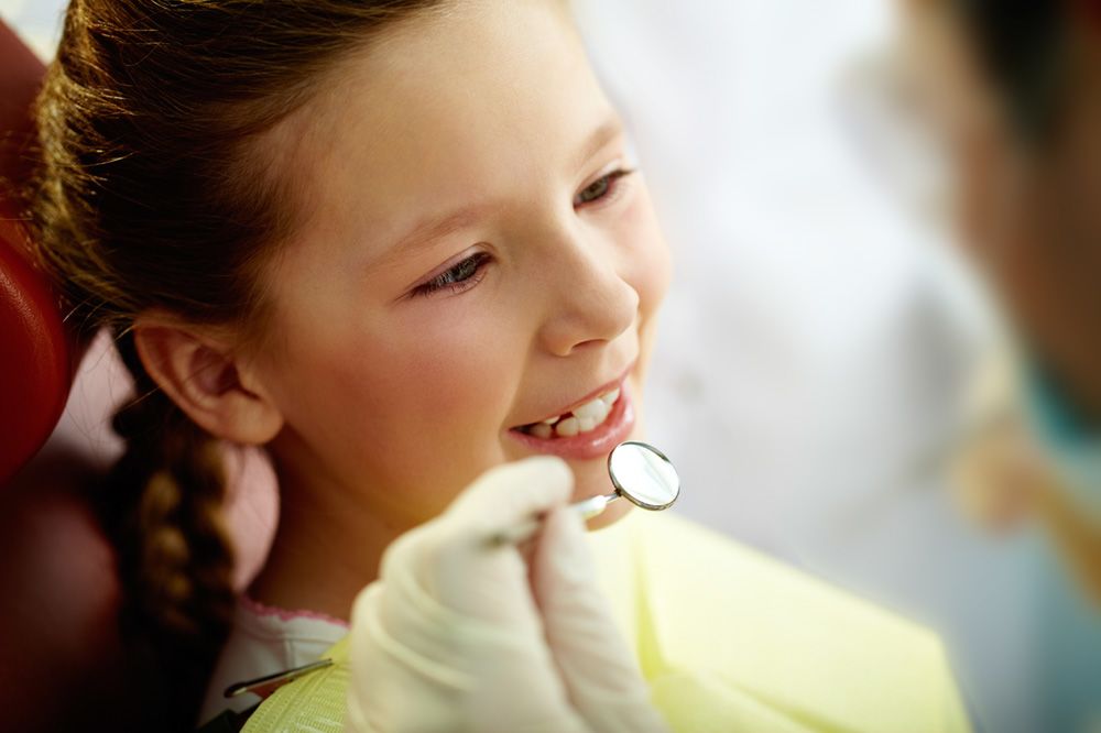 girl undergoing dental exam