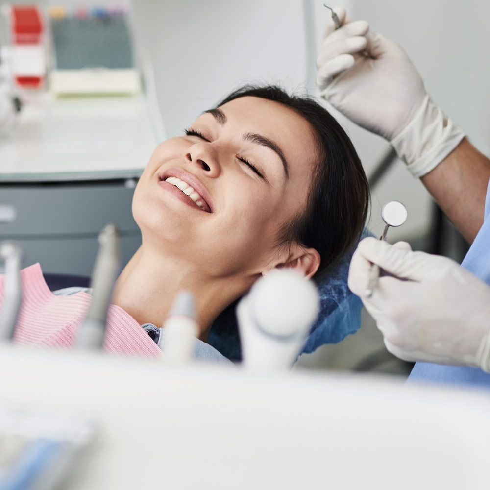 Smiling woman in dental chair