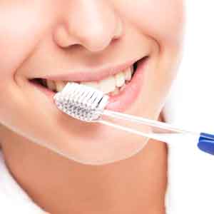 woman brushing teeth